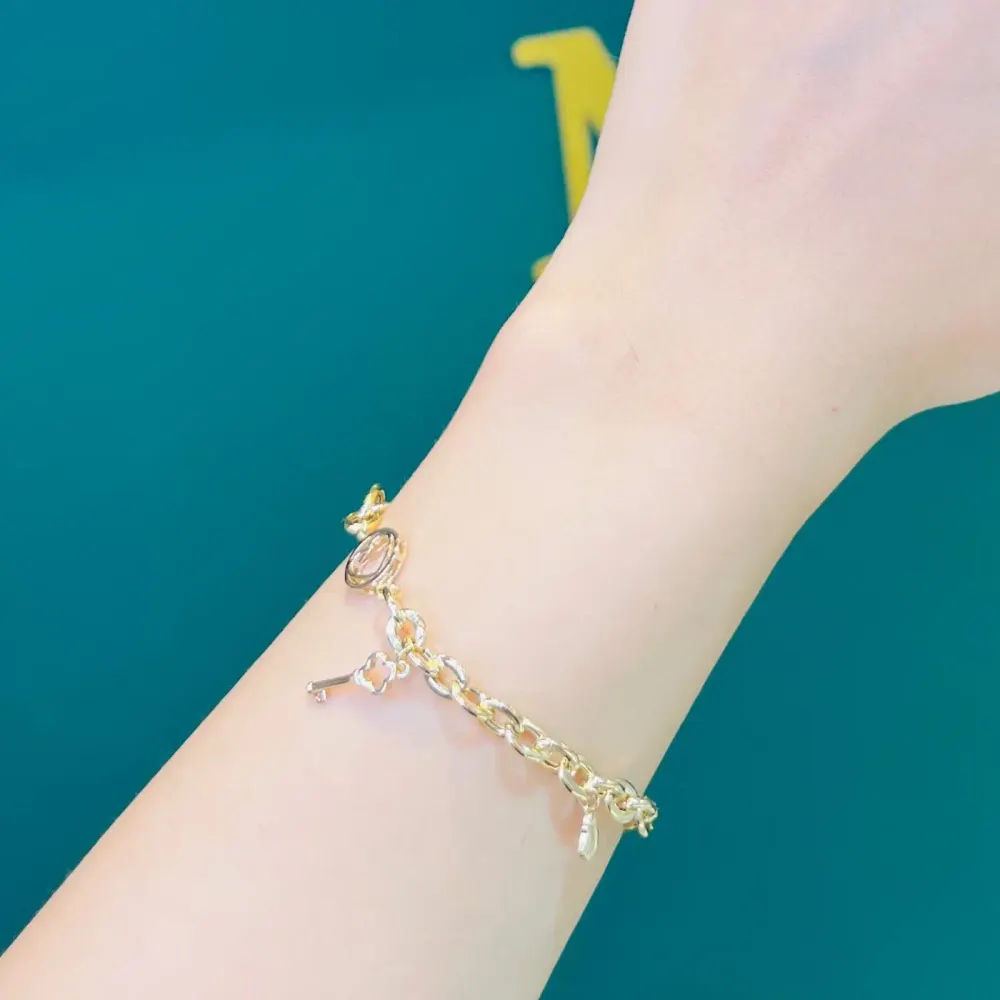 دستبند طلا 18 عیار زنجیری نیلوفر وزن 5.570 گرم اجرت ساخت ۱۳ درصد کد GD01 000260 - تصویر 2